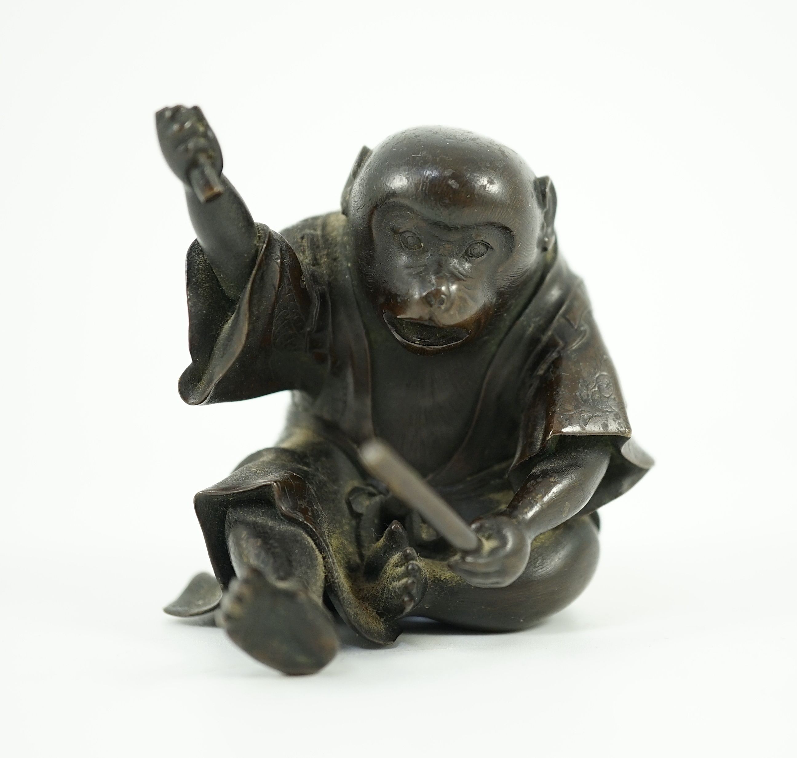 A Japanese bronze figure of a monkey, 19th century, 6cms high.